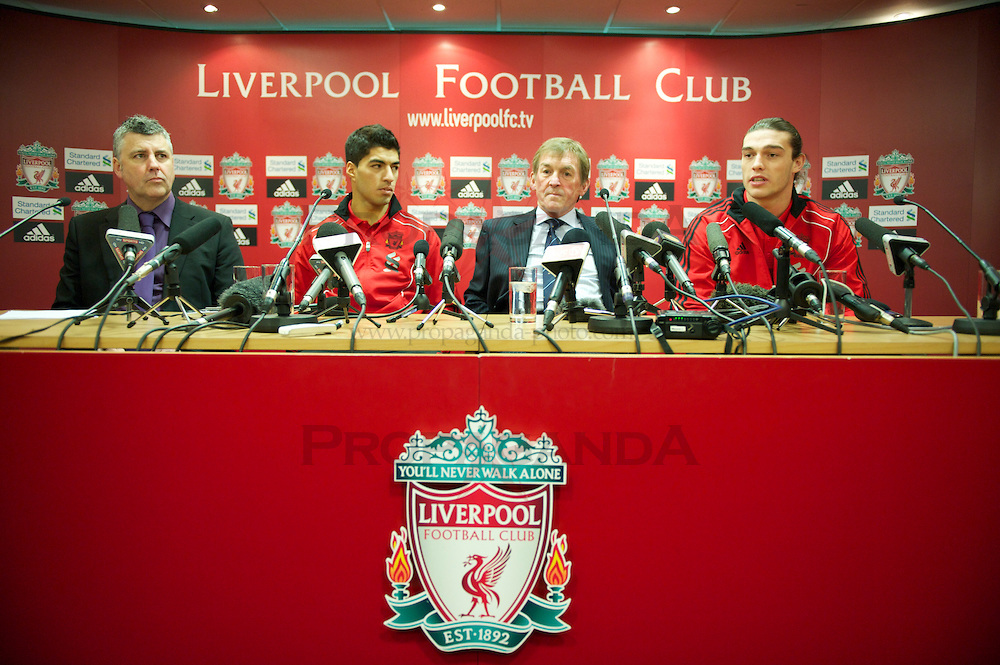 LIVERPOOL, ENGLAND - Thursday, February 3, 2011: Liverpool's new sigingings Luis Suarez and Andy Carroll with manager Kenny Dalglish during a photo-call at Anfield. Suarez signed from Ajax for £22.8m whilst Carroll arrived from Newcastle United for a club record fee of £35m. (Photo by David Rawcliffe/Propaganda)