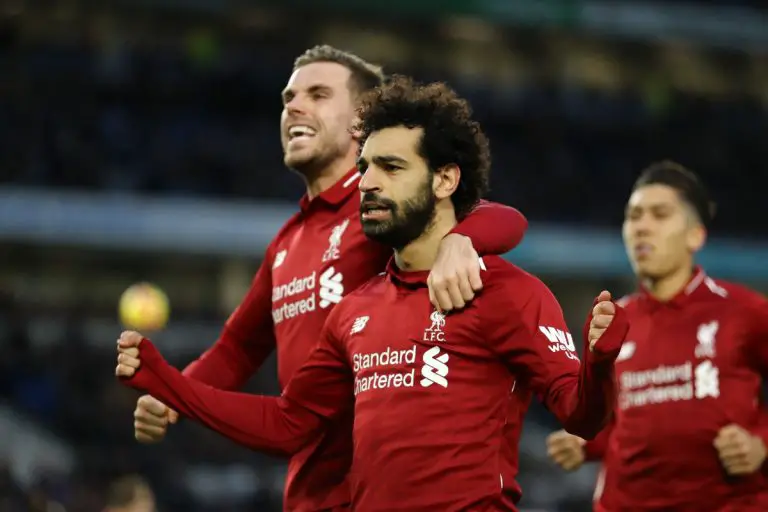 Liverpool players celebrate against Brighton