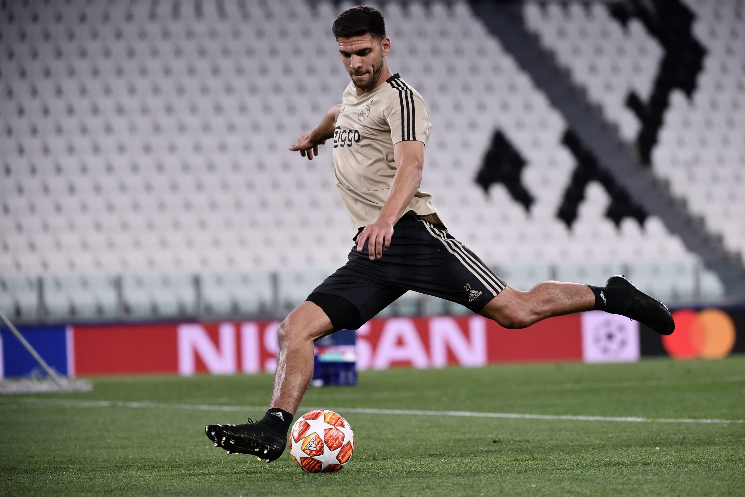 Ajax's Dutch defender Perr Schuurs shoots during a training session on April 15, 2019 at the Juventus stadium in Torino, on the eve of their UEFA Champions League quarter-final second leg football match against Juventus. (Photo by Marco Bertorello / AFP) (Photo credit should read MARCO BERTORELLO/AFP via Getty Images)