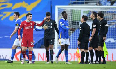 Liverpool players surround Stuart Atwell after the VAR awarded Brighton and Hove Albion a penalty in the closing stages of the game. (GETTY Images)
