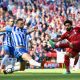 LIVERPOOL, ENGLAND - MAY 13: Mohamed Salah of Liverpool scores his sides first goal during the Premier League match between Liverpool and Brighton and Hove Albion at Anfield on May 13, 2018 in Liverpool, England. (Photo by Michael Regan/Getty Images)
