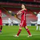 LIVERPOOL, ENGLAND - NOVEMBER 22: Diogo Jota of Liverpool celebrates with teammate Roberto Firmino after scoring their team's second goal during the Premier League match between Liverpool and Leicester City at Anfield on November 22, 2020 in Liverpool, England. Sporting stadiums around the UK remain under strict restrictions due to the Coronavirus Pandemic as Government social distancing laws prohibit fans inside venues resulting in games being played behind closed doors. (Photo by Jon Super - Pool/Getty Images)
