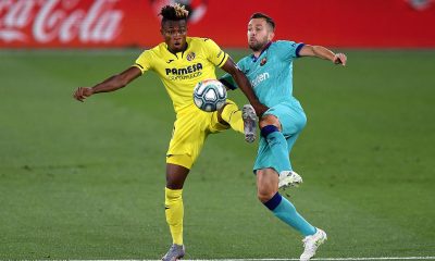 VILLAREAL, SPAIN - JULY 05: Samuel Chukwueze of Villarreal and Jordi Alba of Barcelona during the Liga match between Villarreal CF and FC Barcelona at Estadio de la Ceramica on July 05, 2020 in Villareal, Spain. (Photo by Alex Caparros/Getty Images)