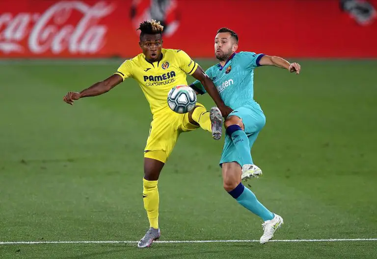 VILLAREAL, SPAIN - JULY 05: Samuel Chukwueze of Villarreal and Jordi Alba of Barcelona during the Liga match between Villarreal CF and FC Barcelona at Estadio de la Ceramica on July 05, 2020 in Villareal, Spain. (Photo by Alex Caparros/Getty Images)