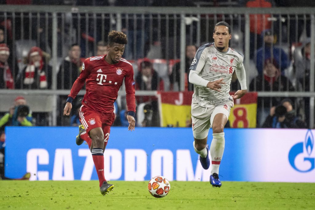 Kingsley Coman of Bayern Munich dribbles past Virgil van Dijk of Liverpool during their UEFA Champions League meeting.