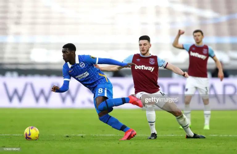 Yves Bissouma of Brighton goes past Declan Rice of West Ham United during the Premier League match. (Photo by Kirsty Wigglesworth - Pool/Getty Images)