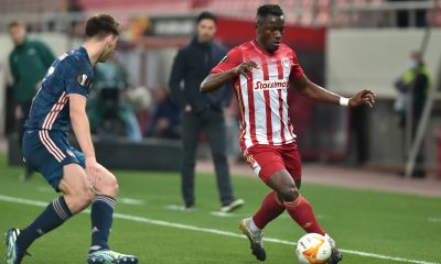 Mady Camara of Olympiakos is challenged by Kieran Tierney of Arsenal during the UEFA Europa League Round of 16 First Leg match between Olympiacos and Arsenal at Karaiskakis Stadium on March 11, 2021 in Piraeus, Greece. (Photo by Milos Bicanski/Getty Images)