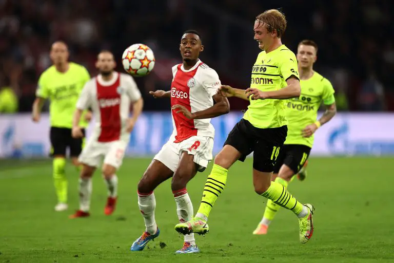 Ryan Gravenberch of AFC Ajax battles for the ball with Julian Brandt of Borussia Dortmund. (Photo by Dean Mouhtaropoulos/Getty Images)