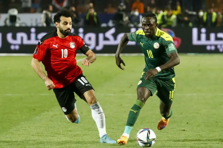 Mohamed Salah and Sadio Mane playing in the Egypt vs Senegal match. (Photo by KHALED DESOUKI/AFP via Getty Images)