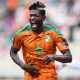 Ibrahim Sangare celebrates at AFCON playing for Ivory Coast. (Photo by CHARLY TRIBALLEAU/AFP via Getty Images)