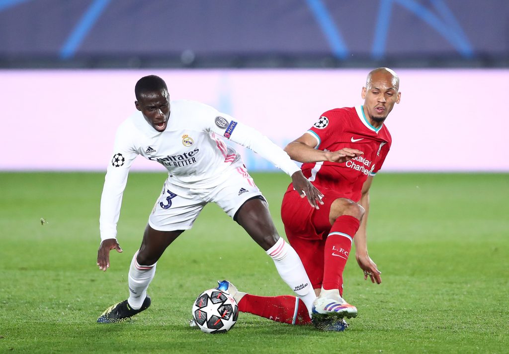 Ferland Mendy of Real Madrid battles for the ball with Liverpool star, Fabinho. (Photo by Fran Santiago/Getty Images)