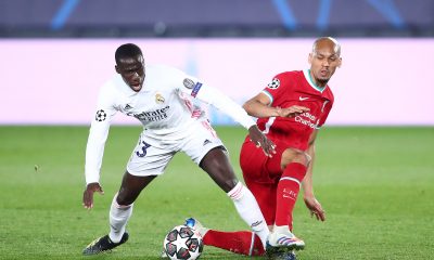 Ferland Mendy of Real Madrid battles for the ball with Liverpool star, Fabinho. (Photo by Fran Santiago/Getty Images)