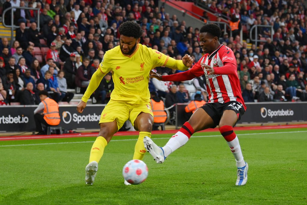 Joe Gomez of Liverpool is challenged by Nathan Tella of Southampton.