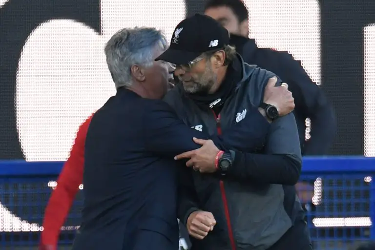 Jurgen Klopp of Liverpool with Carlo Ancelotti when he was the manager of Everton. (Photo by PETER POWELL/POOL/AFP via Getty Images)