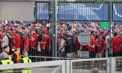 Liverpool fans stand outside unable to get in in time leading to the match being delayed at Parc des Princes. (Photo by THOMAS COEX/AFP via Getty Images)