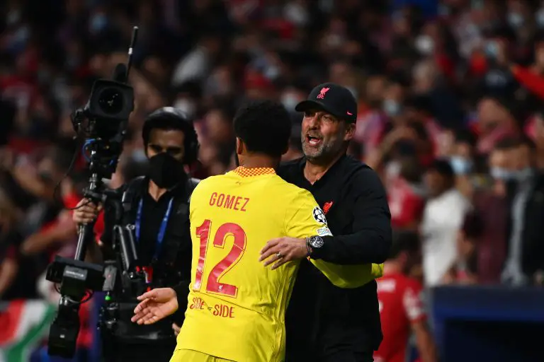 Joe Gomez with Jurgen Klopp of Liverpool during a UEFA Champions League game against Atletico Madrid.