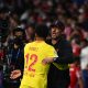 Joe Gomez with Jurgen Klopp of Liverpool during a UEFA Champions League game against Atletico Madrid.