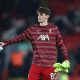 Conor Bradley of Liverpool warms up prior to the Carabao Cup Quarter Final match between Liverpool and Leicester City
