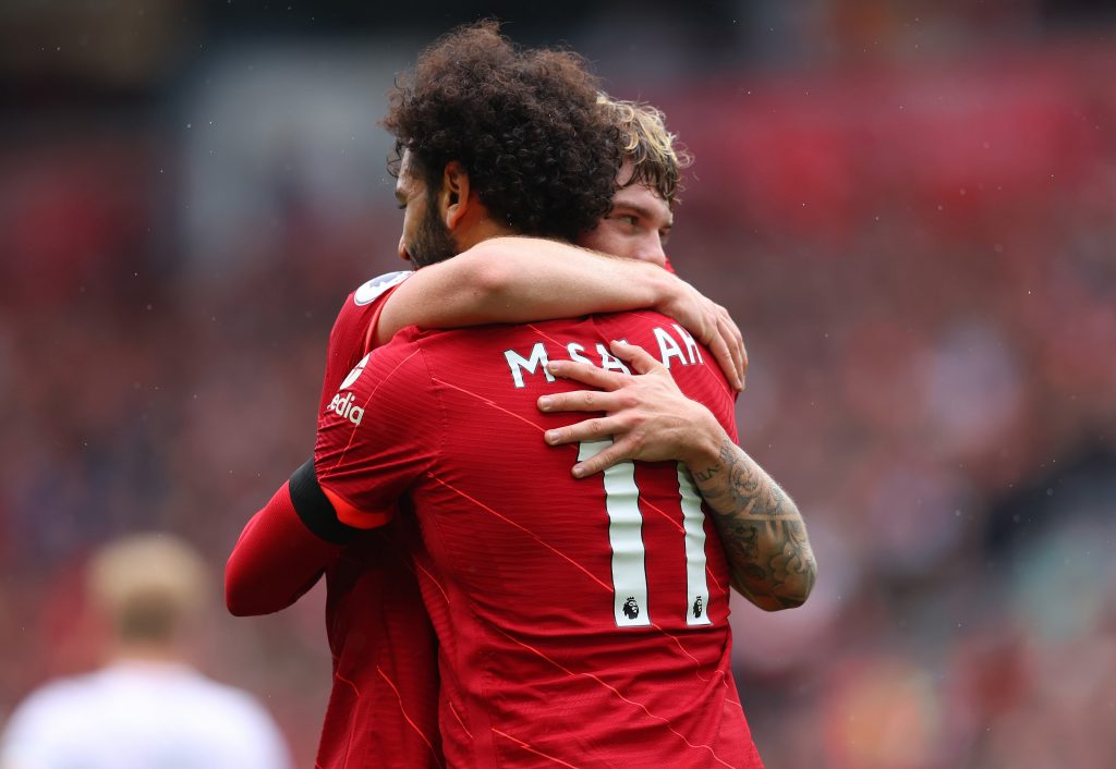 Mohamed Salah hugs Liverpool teammate, Harvey Elliott.