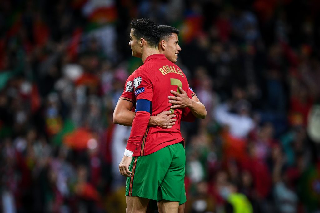 Matheus Nunes of Portugal hugs Cristiano Ronaldo. 