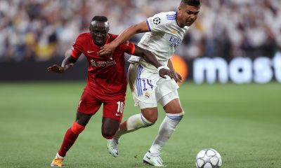 Sadio Mane of Liverpool is challenged by Casemiro of Real Madrid.