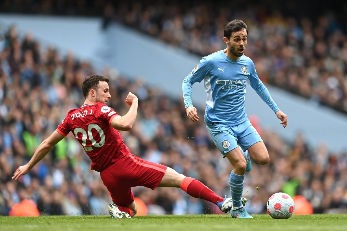 Bernardo Silva in action for Manchester City against Diogo Jota of Liverpool.