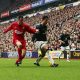 Cristiano Ronaldo of Manchester United shields the ball from Jamie Carragher of Liverpool in a match back in 2005.
