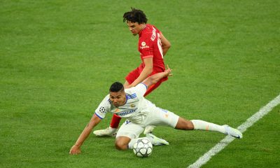 Trent Alexander-Arnold of Liverpool battles for possession with Casemiro of Real Madrid. (Photo by Matthias Hangst/Getty Images)