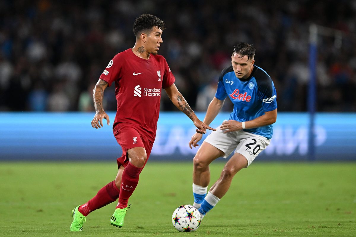 Roberto Firmino of Liverpool is put under pressure by Piotr Zielinski of SSC Napoli. 