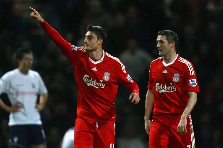 Albert Riera with Robbie Keane of Liverpool in a game against Preston North End.