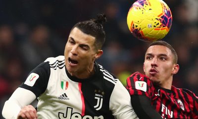 Cristiano Ronaldo and AC Milan's Ismael Bennacer vie for the ball.