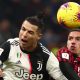 Cristiano Ronaldo and AC Milan's Ismael Bennacer vie for the ball.
