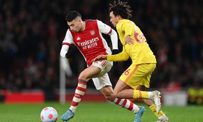 Gabriel Martinelli of Arsenal battles for possession with Trent Alexander-Arnold of Liverpool.