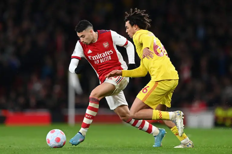 Gabriel Martinelli of Arsenal battles for possession with Trent Alexander-Arnold of Liverpool.