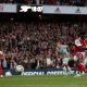 Arsenal's Bukayo Saka scores a penalty kick past Liverpool's Alisson Becker at the Emirates.