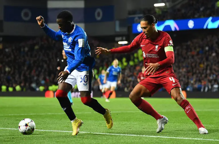 Rangers' Fashion Sakala vies with Liverpool's Virgil van Dijk during a UEFA Champions League Group match at Anfield in October 2022. (Photo by ANDY BUCHANAN/AFP via Getty Images)