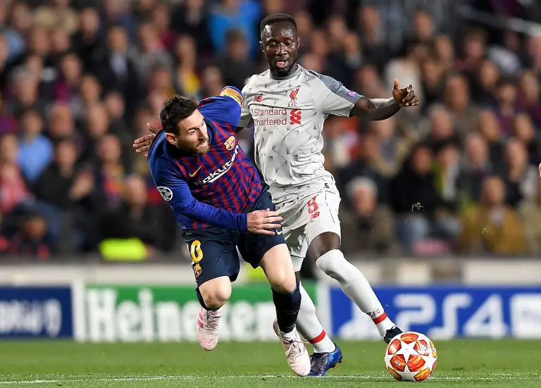 Lionel Messi of Barcelona vies for possession with Liverpool midfielder, Naby Keita, during a UEFA Champions League game.