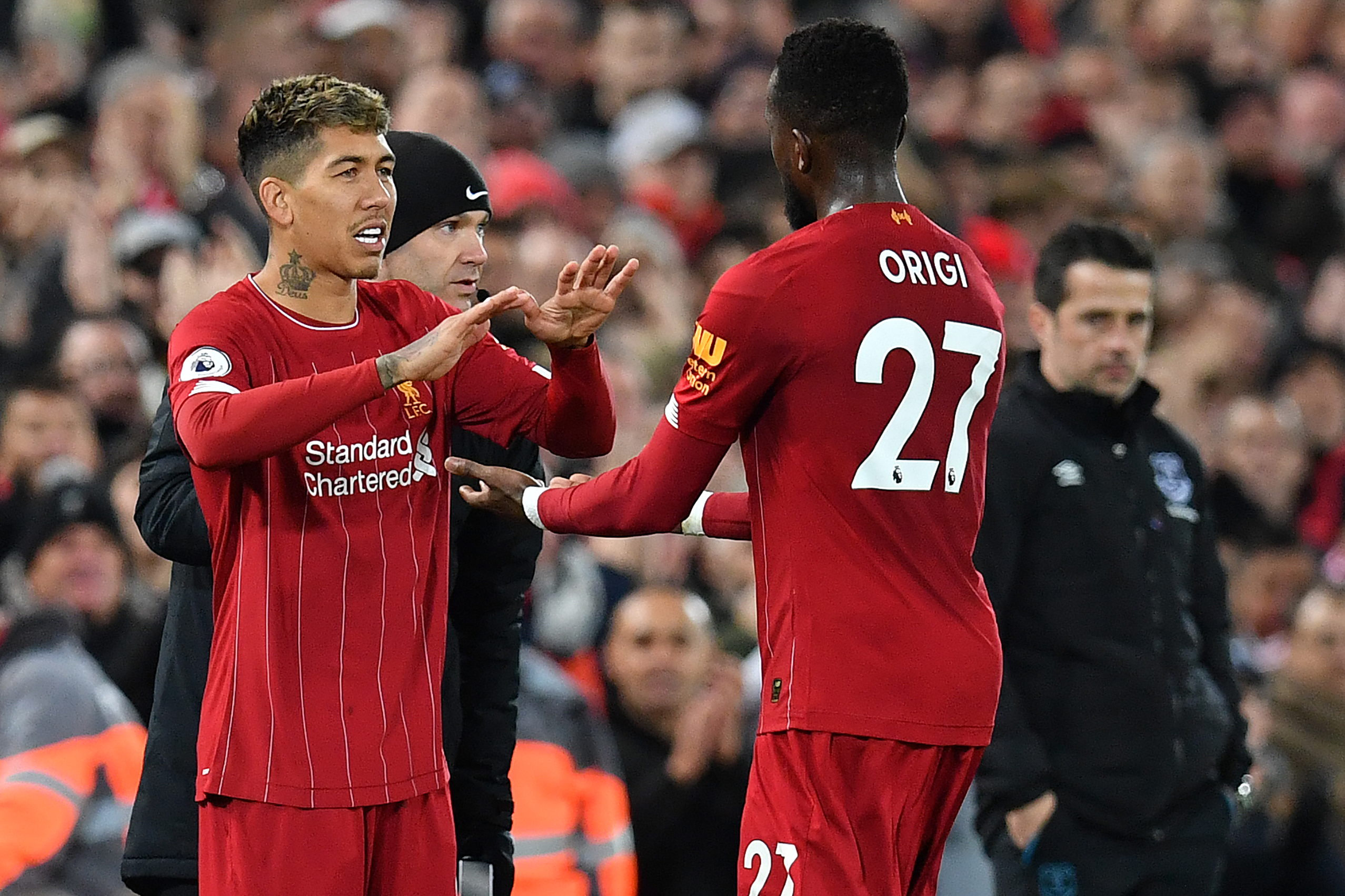 Roberto Firmino and Divock Origi during their time at Liverpool. (Photo by PAUL ELLIS/AFP via Getty Images)