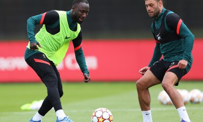 Naby Keita and Alex Oxlade-Chamberlain of Liverpool battle for the ball during a training session.