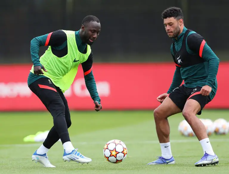 Naby Keita and Alex Oxlade-Chamberlain of Liverpool battle for the ball during a training session.