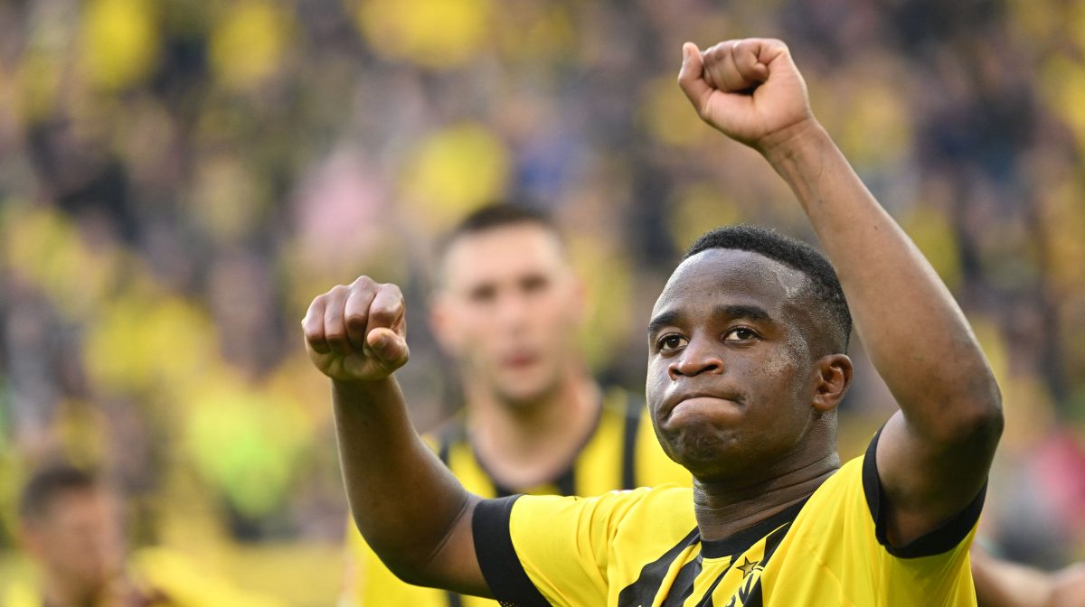 Youssoufa Moukoko celebrates scoring a goal for Borussia Dortmund.