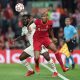 Franck Kessie of AC Milan in action against Fabinho Tavares of Liverpool during a UEFA Champions League group stage game in September 2021.