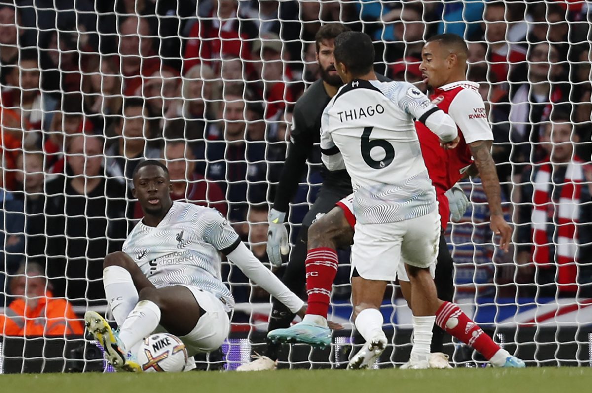 Thiago Alcantara and Ibrahima Konate of Liverpool try to halt Arsenal's Gabriel Jesus. 