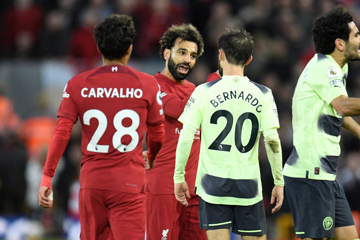 Liverpool's Mohamed Salah argues with Manchester City's Bernardo Silva as Fabio Carvalho looks on.