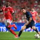 Benfica's Florentino Luis vies with Paris Saint-Germain's Lionel Messi.