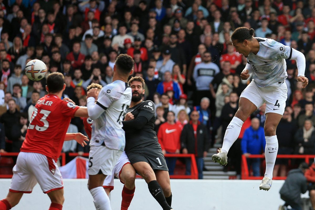Virgil van Dijk leaps for a header in Liverpool's league match against Nottingham Forest. 