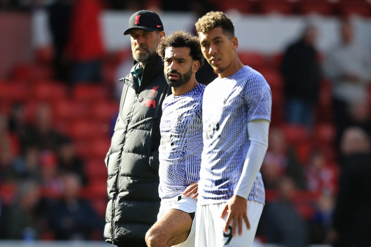 Jurgen Klopp with Mohamed Salah and Roberto Firmino of Liverpool on the day of the team's shock 1-0 defeat to Nottingham Forest. (Photo by LINDSEY PARNABY/AFP via Getty Images)