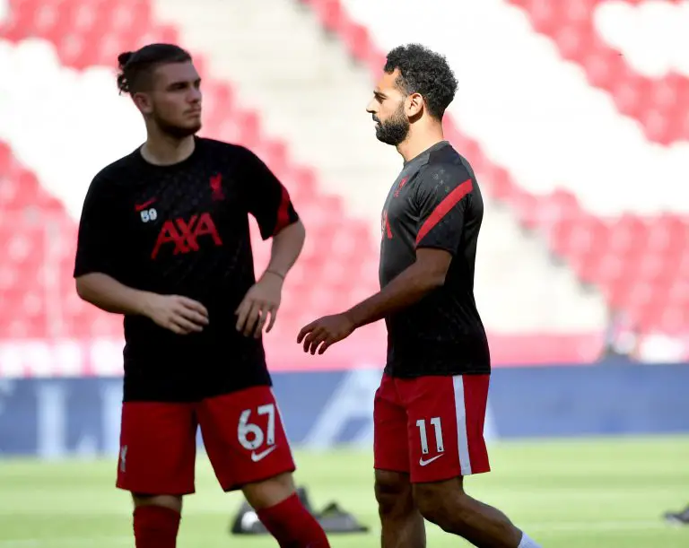 Liverpool's Mohamed Salah Harvey Elliott during a warm-up session.