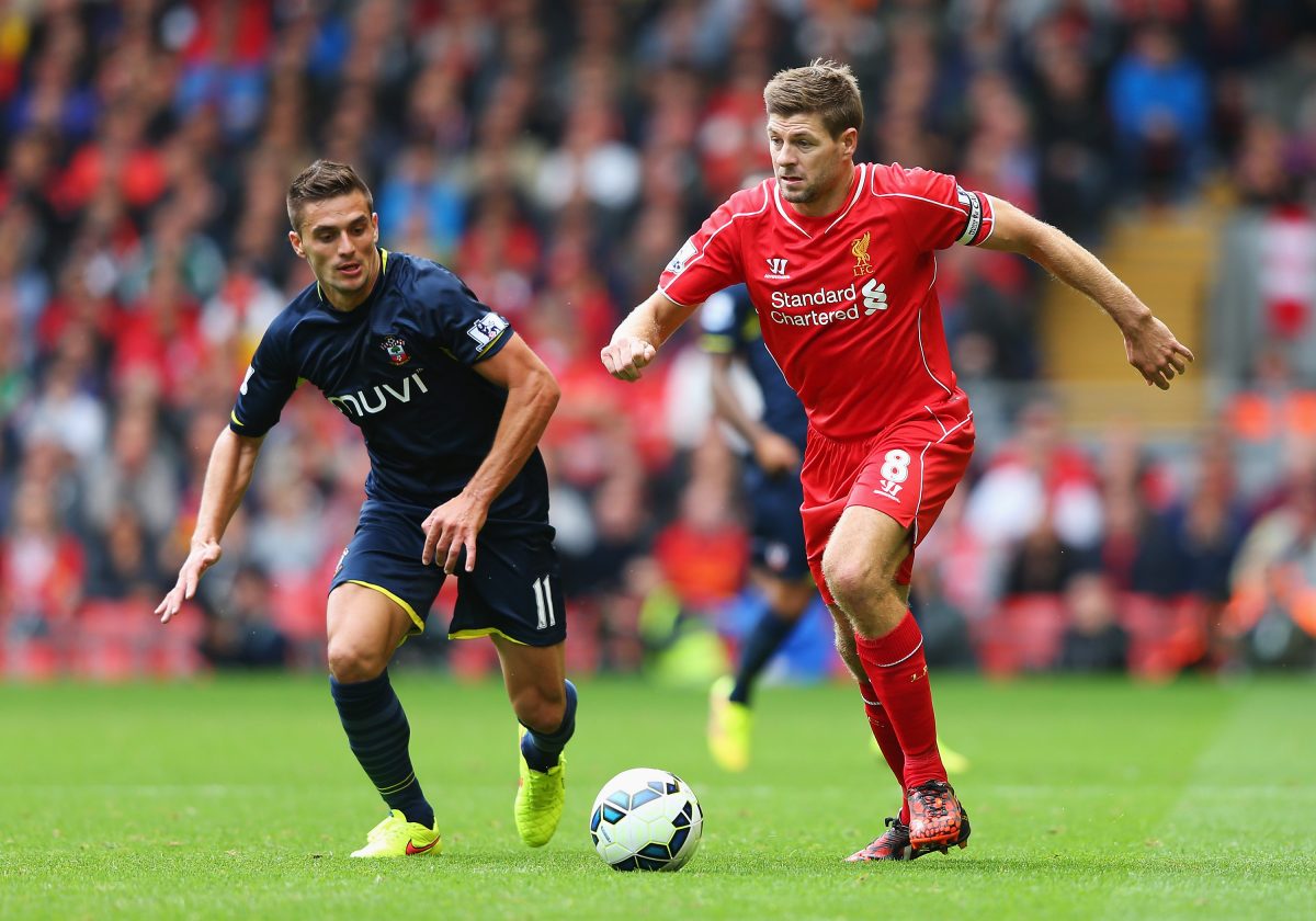 Dusan Tadic during his Southampton days in a duel against Liverpool icon Steven Gerrard.