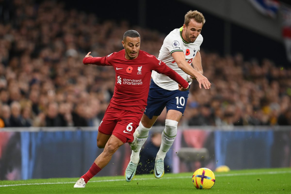 Harry Kane of Tottenham Hotspur challenges Thiago Alcantara of Liverpool. (Photo by Mike Hewitt/Getty Images)